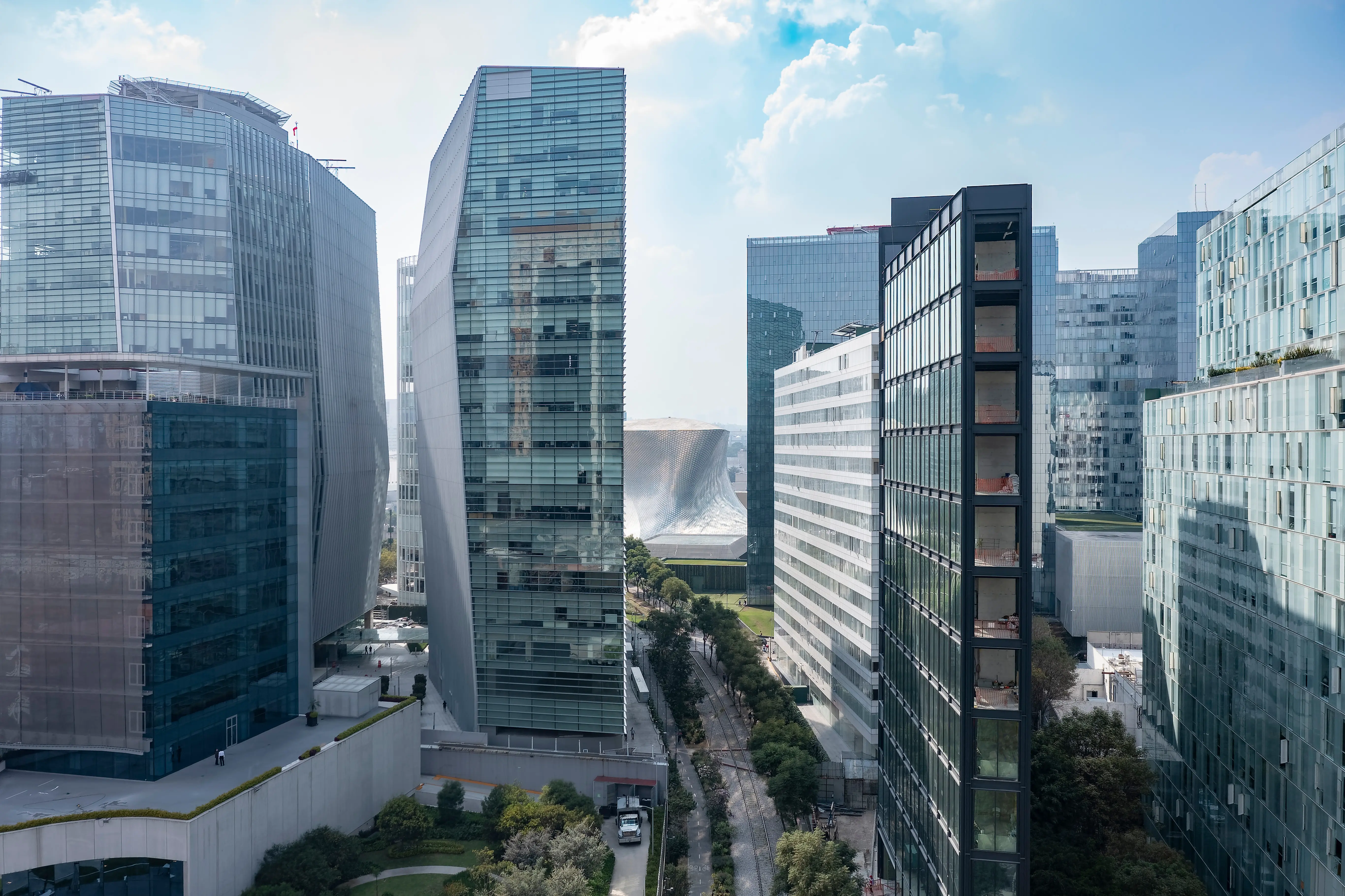 Modern skyscrapers along Paseo de la Reforma with the Museo Soumaya in the distance