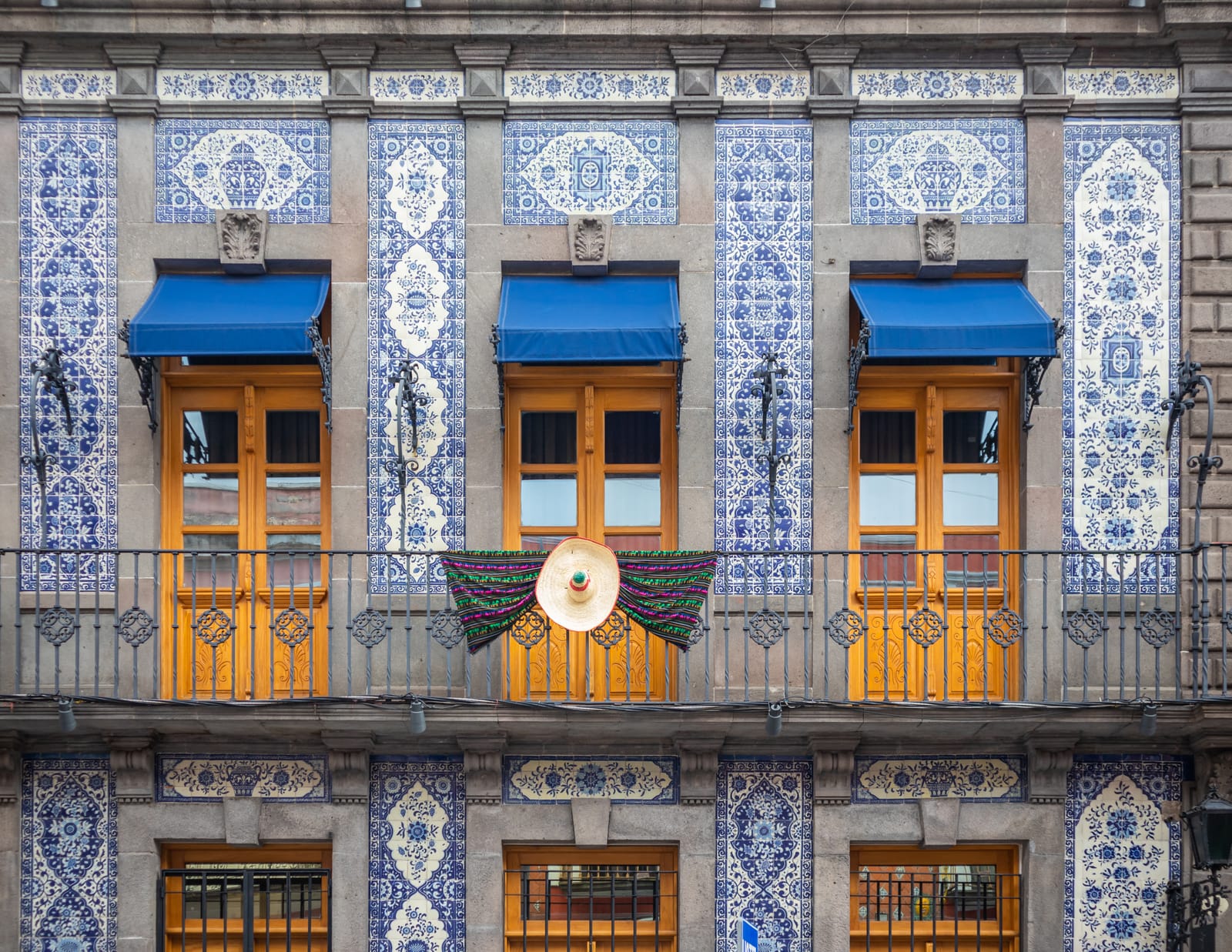 Talavera-tiled facade with wooden balconies in Puebla