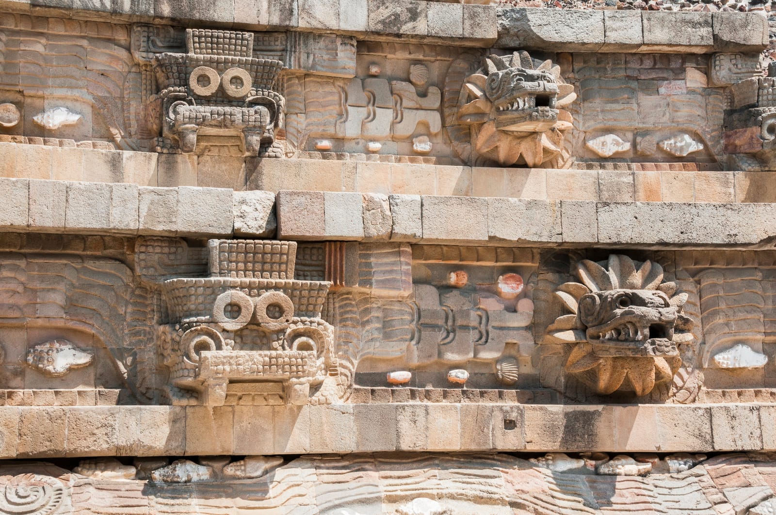 Carved serpent heads on the Temple of the Feathered Serpent