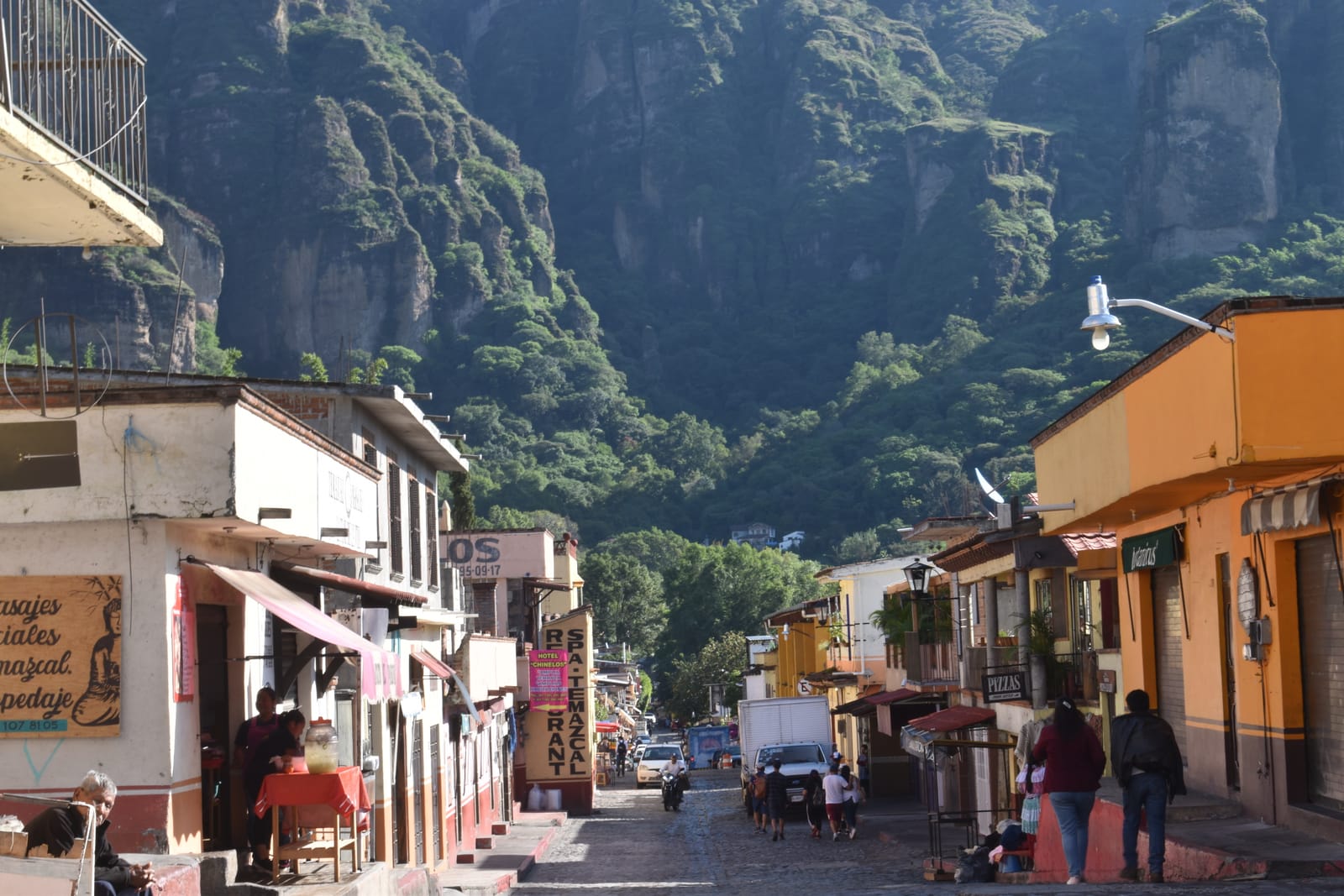 Tepoztlán's main street with the cliffs rising behind