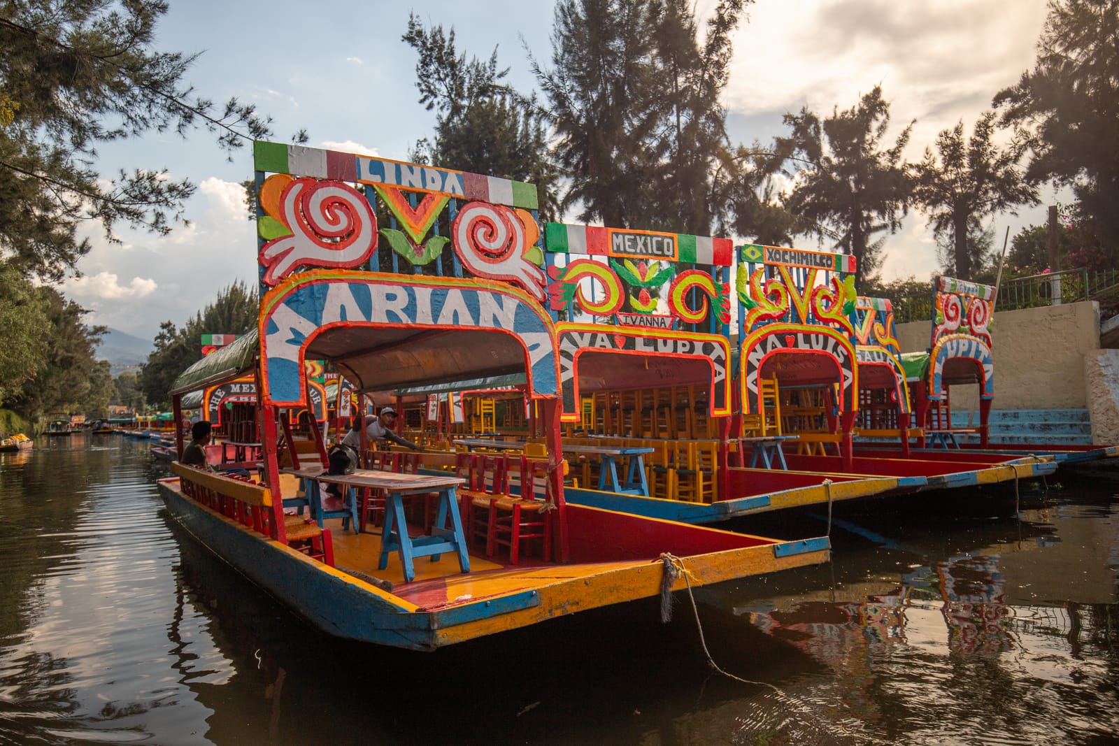 Colorful trajineras moored on a Xochimilco canal